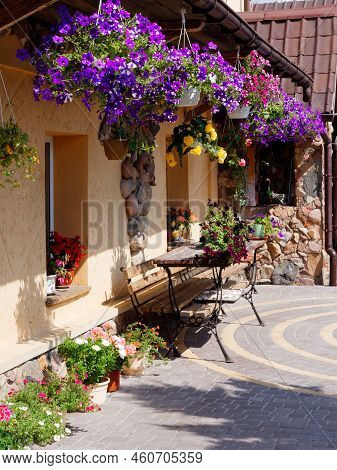 Brest, Belarus - August 18, 2022: Beautiful Stone House Decorated With Flowers And Greenery In Kamen