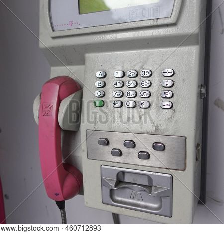 Pink Pay Phone From A Side Angle View