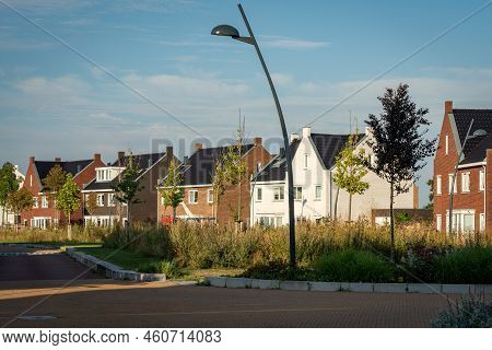Modern Residential Neighbourhood In The Netherlands, Street With Modern Houses Nearby Spaarnwoude