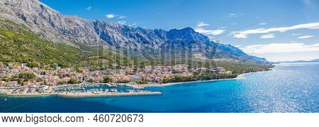 Panorama Of Baska Voda Town With Harbor Against Mountains In Makarska Riviera, Dalmatia, Croatia