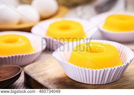 Quindim Or Brisa Do Lis, Tasty Dessert Made With Eggs In The Background, Typical Recipe From Brazil 