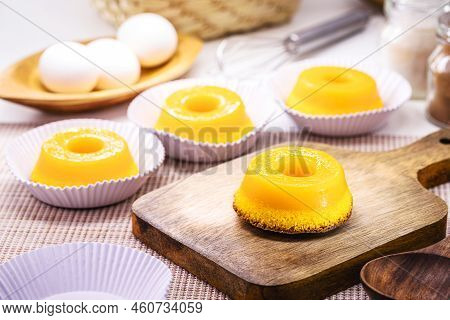 Quindim Or Brisa Do Lis, Tasty Dessert Made With Eggs In The Background, Typical Recipe From Brazil 