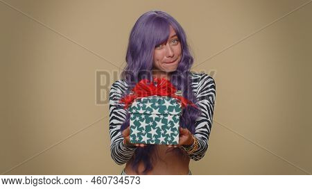 Positive Smiling Lovely Pretty Young Woman Presenting Birthday Gift Box Stretches Out Hands, Offer W
