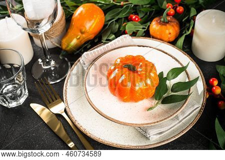 Autumn Table Setting With Plate, Pumpkin And Candles. Thanksgiving Food Festive Dinner Concept.