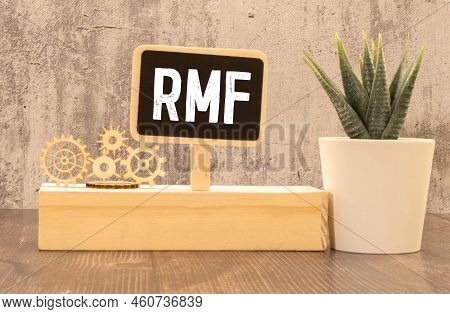 Businessman Hand With Pen Pointing To Rmf Sign On The Paper