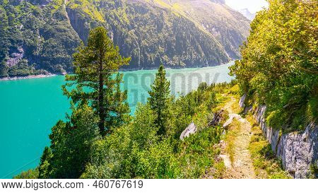 Vivid Blue Mountain Lake In Summer Alps. Speicher Zillergrundl Dam, Zillertal Alps, Austria