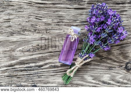 Lavender's Spa Products With Dried Lavender Flowers On A Wooden Table. Flat Lay Bath Salt And Massag
