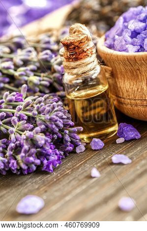 Lavender's Spa Products With Dried Lavender Flowers On A Wooden Table. Flat Lay Bath Salt And Massag
