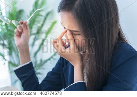 Businesswoman Is Using Fingers To Squeeze The Eye Area, Due To Wearing Glasses, Using The Eyes And T