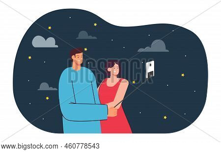 Happy Boyfriend And Girlfriend Taking Selfie Together At Night. Man And Woman Taking Photo On Smartp