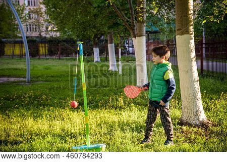 Happy Boy Is Playing Tetherball Swing Ball Game In Summer Campin