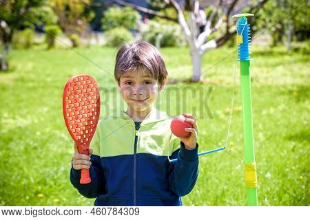 Happy Boy Is Playing Tetherball Swing Ball Game In Summer Campin