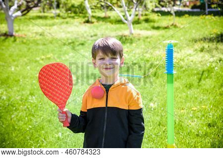 Happy Boy Is Playing Tetherball Swing Ball Game In Summer Campin