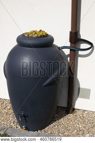 Rainwater Barrel Connected To The Gutter, Water Saving Concept