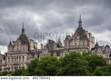 London, England, Uk - July 6, 2022: From Thames River. 2 Whitehall Towers Behind Green Follage Belt 