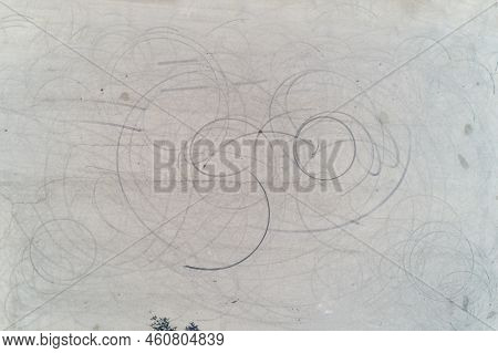 Aerial View Of Black Tire Marks From A Car Burning Rubber