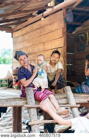 Chiang Mai, Thailand – 25 May 2021, Hill Tribe Family With Their Home. They Live In Omkoi Districk,