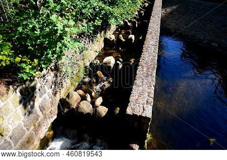 Turbid Water During The Flood Falls From Large Dams And Forms A Lot Of Foam. Fish Pass Is A Neutrali