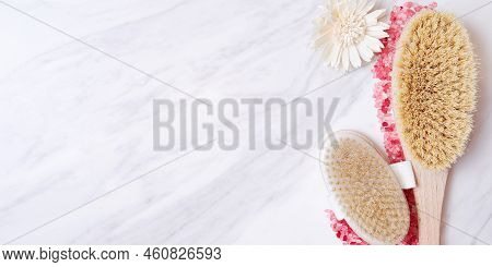 Wooden Scrub Brush, Pink Magnesium Iodized Salt Grain On The Marble Floor. Relaxation Therapy Templa