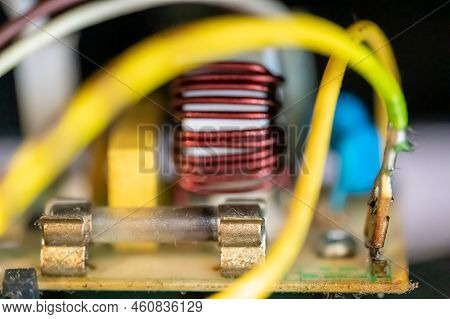 Brown Damaged Fuse That Has Blown And Defective.