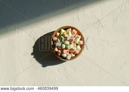 Multicolored Marshmallows Background. Mini Powder Cover Candies. White Background