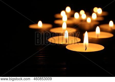 Burning Candles And Space For Text On Black Background, Closeup. Memory Day
