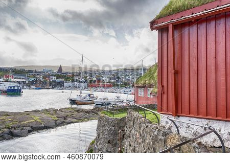 Faroe Islands. Denmark. 11 May. 2022. Boats Parked In The Bay, Among The Beautiful Small, Colorful H