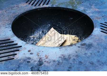Large Round Metal Grill With Firewood Inside. Grill Ready To Go