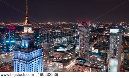 Aerial Hyperlapse Of Warsaw Business Center At Night: Skyscrapers And Palace Of Science And Culture.