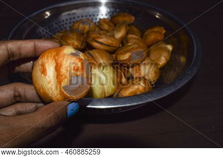 Female Holding Ice Apples Also Known As Palmyra From A Palm Tree. Toddy Munjal