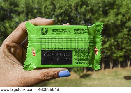 Female Holding Utensil Dishwash Soap Vim Bar Lemon. Lemon Vim Bar Soap Dish Washing Packet Of Rs. 5 