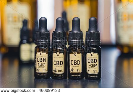 05.28.2022 Warsaw, Poland. Professional Dark-glass Bottles Of Cbd, Cbn, And Cbda Cannabis With Vario