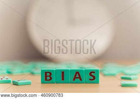 The Word Bias Made Of Small Colorful Game Board Pieces With Letters Imprinted On Them. Break The Bia