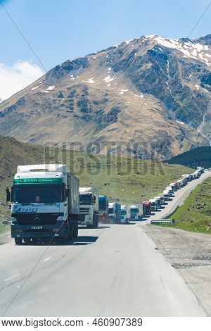 18.05.2022. Kazbegi, Georgia. Trucks Forming A Long Queue And Waiting To Pass The Border Between Geo