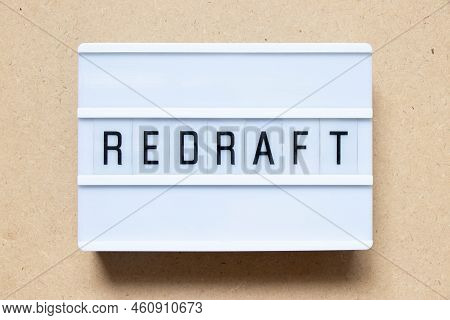 Lightbox With Word Redraft On Wood Background