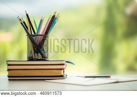 Object Education Green Nature Background With Stack Of Ancient Books Or Old Bible, Open Paper Book O