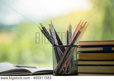 Object Education Green Nature Background With Stack Of Ancient Books Or Old Bible, Open Paper Book O