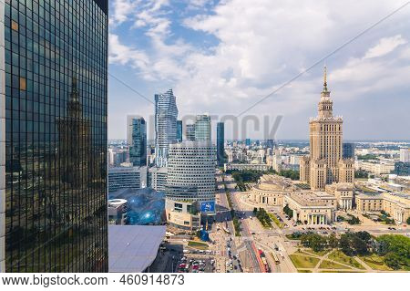 7.22.2022 Warsaw, Poland. The Reflection Of Palace Of Culture And Science On The Glass Side Of Centr