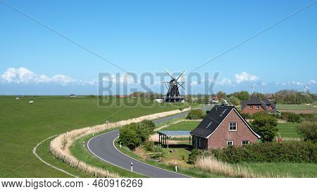 Panoramic Image Of The Windmill Of Pellworm Against Blue Sky, North Frisia, Germany