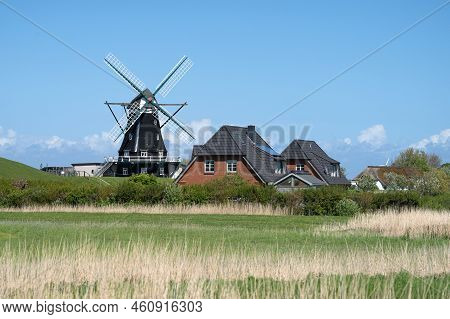 Panoramic Image Of The Windmill Of Pellworm Against Blue Sky, North Frisia, Germany
