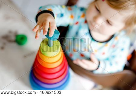 Cute Beautiful Little Baby Girl Playing With Educational Toys At Home Or Nursery, Indoors. Happy Hea