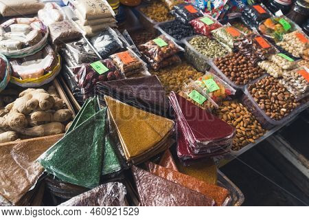 Counter Of Nuts And Georgian Traditional Sun-dried Pureed Fruit Sheets Called Tklapi. High Quality P
