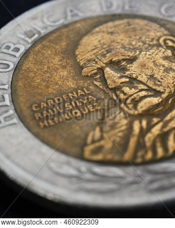 Translation: Republic Of Chile. Coin Of 500 Chilean Pesos Close-up. Peso Of Chile. News About Econom