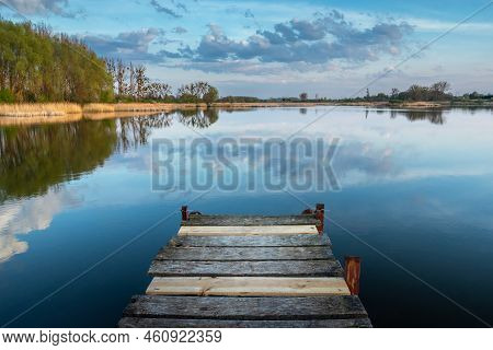Wooden Pier Jutting Out Into The Lake, Spring View, Eastern Poland