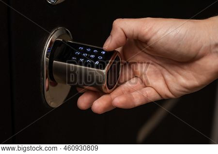 Woman Opens The Combination Lock On The Door To The Apartment. Keyless Entry.
