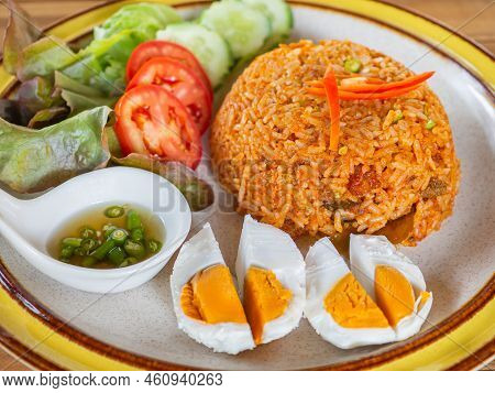 Fried Rice With Sweet Chili Sauce Crispy Slid Fish And Salted Egg. Close-up Photo.