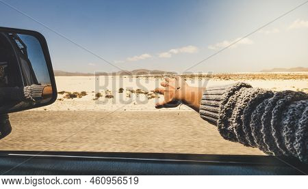 Girl Close Up Hand Playing With The Wind Like A Wing Outside The Car Traveling For Alterntive Vacati