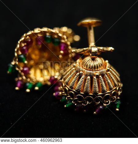 Antique Earrings Called Jhumkas Made Of Gold With Precious Stones From A Vintage Collection Isolated