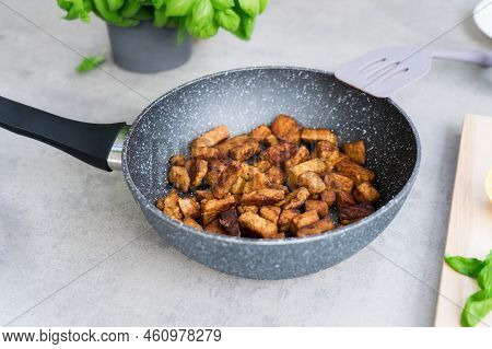 Roasted Tempeh Or Tempeh, Made Of Fermented Soybean Seeds. Fried Cubed Tempeh In The Pan. Soya Prote