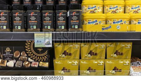 Latvia, Riga, August, 2022: Papua Newguinea Instant Coffee And Nesquik Chocolate Drink With  Chocola